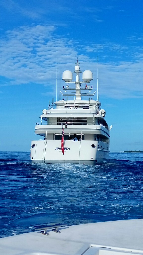 Motor yacht RoMa photographed from the stern in Maldivian waters